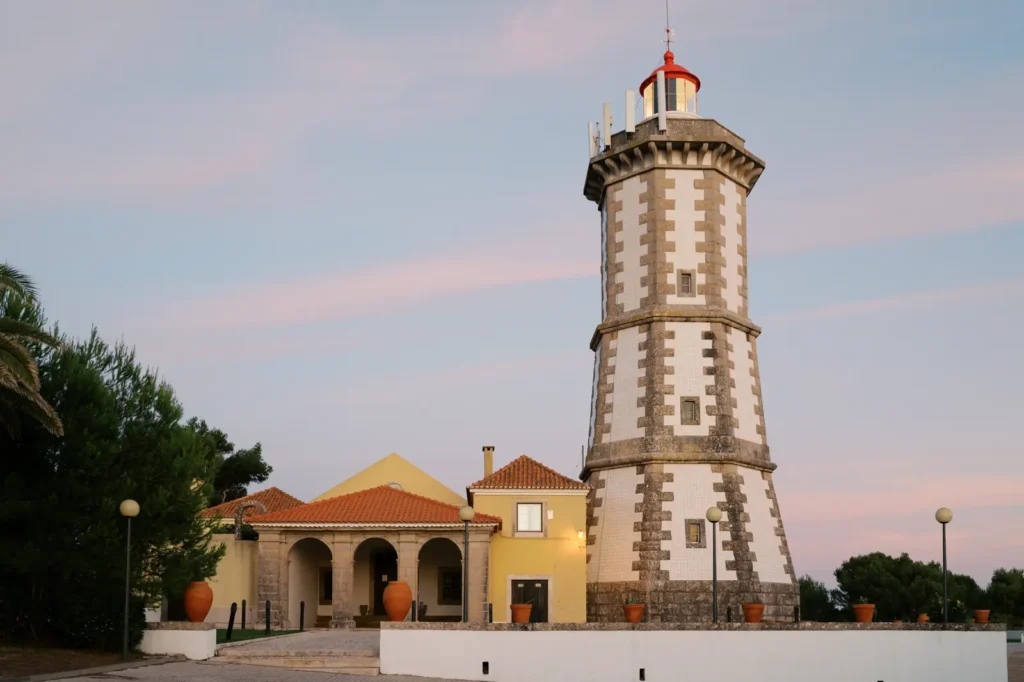 The Guia lighthouse in Cascais at the end of the day . The perfect cascais wedding venue