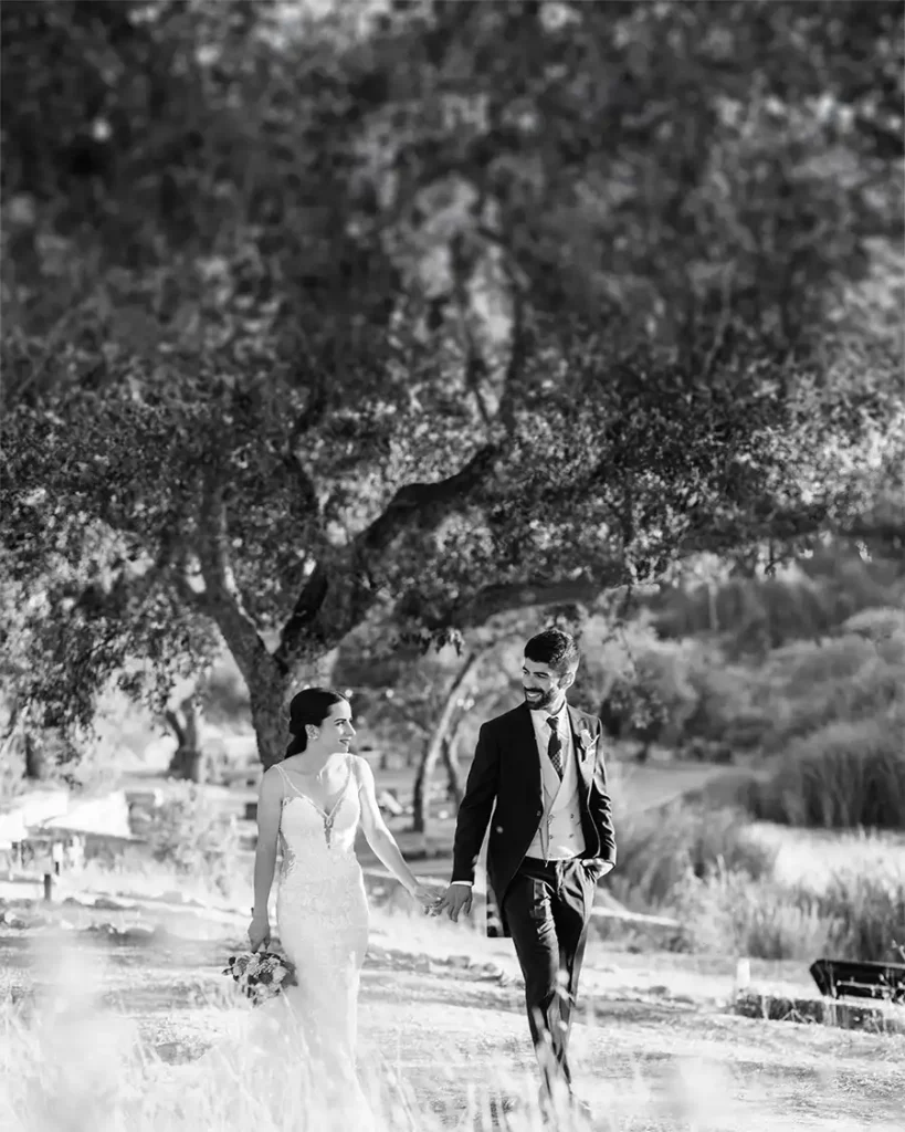 Bride an groom walking in Alentejo area on their wedding day captured by Evora Wedding Photographer