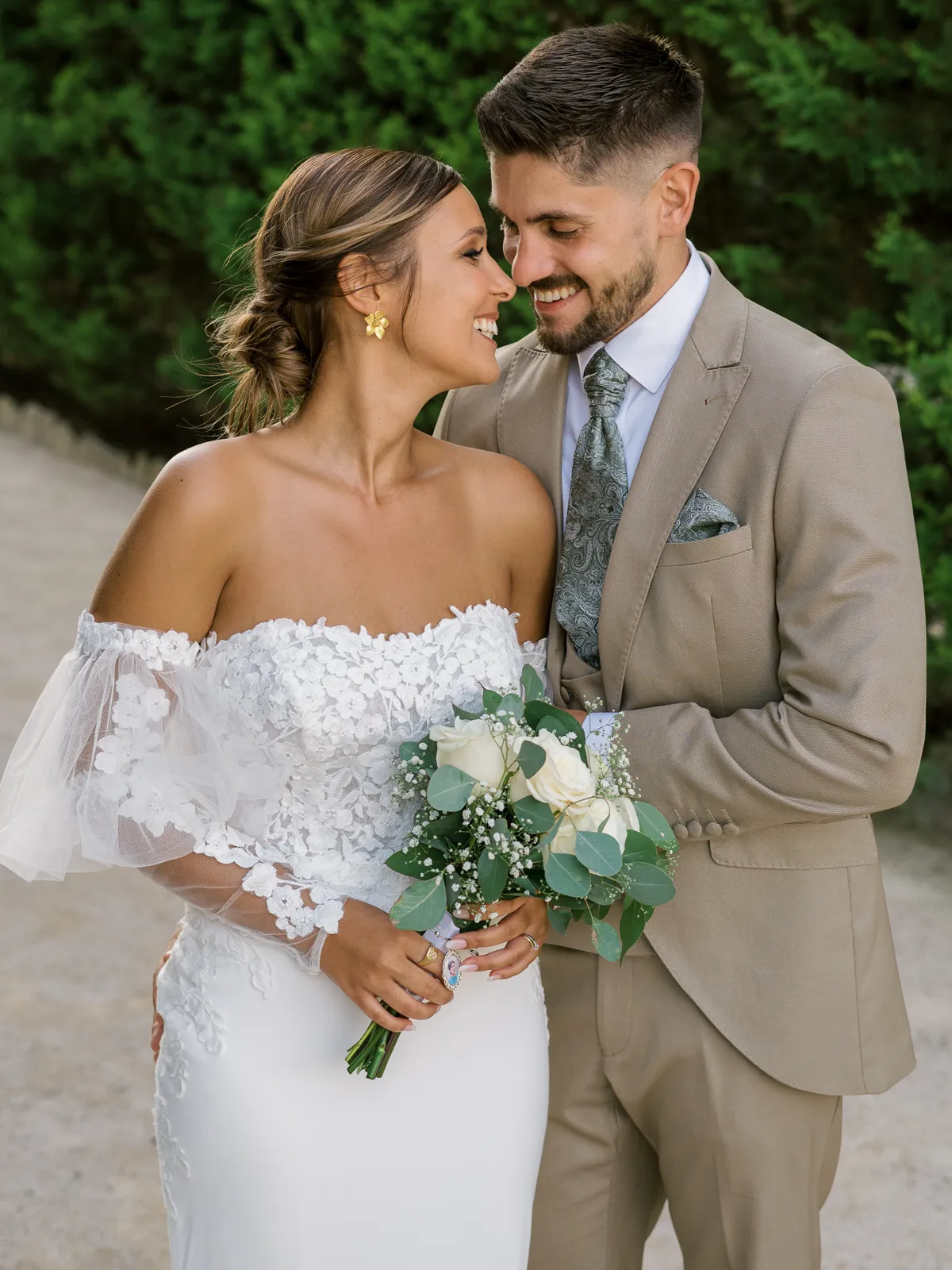 Candid moment of a bride and groom laughing during their wedding at Quinta do Valle do Riacho, Lisbon.