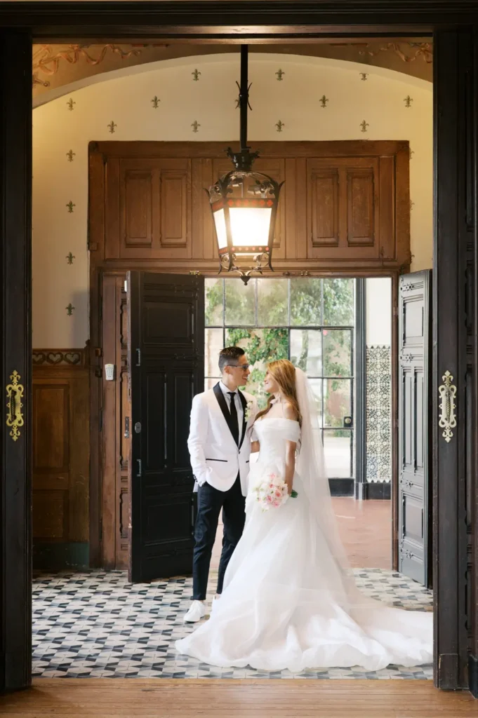 Couple Monica and Bryan at their wedding day in one of the rooms of Palacio da Cruz at Estoril, Lisbon