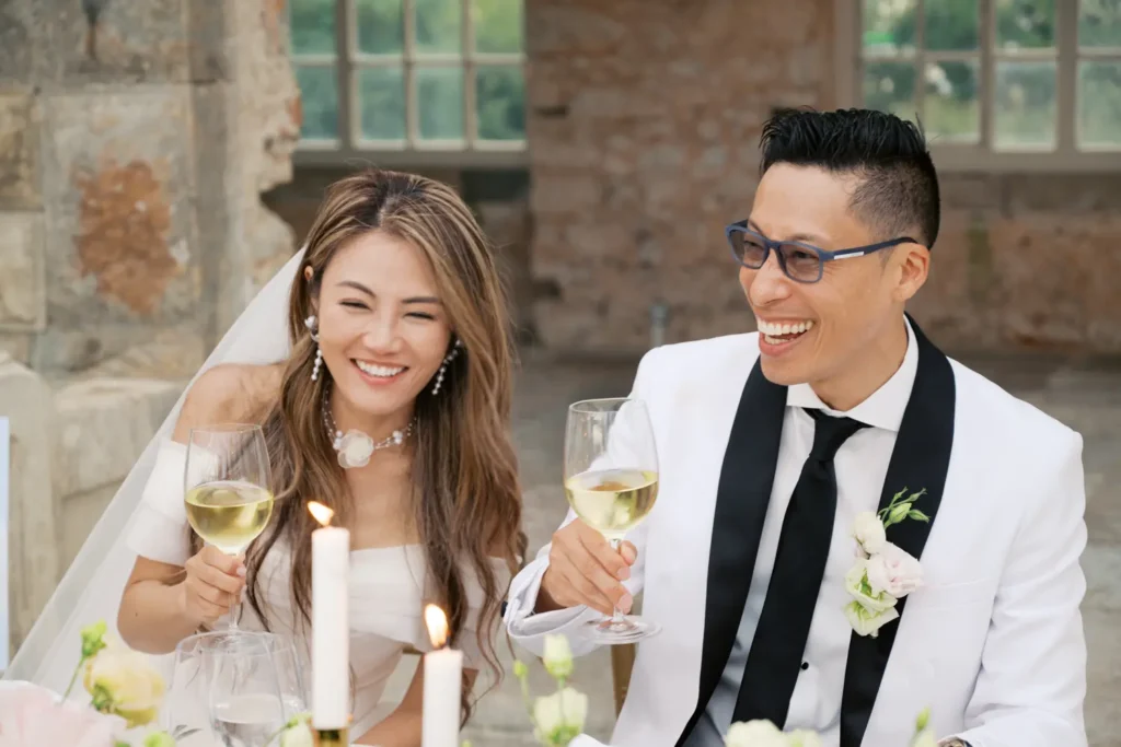 Couple laughing naturally, capturing authentic memories and emotions of their wedding day.