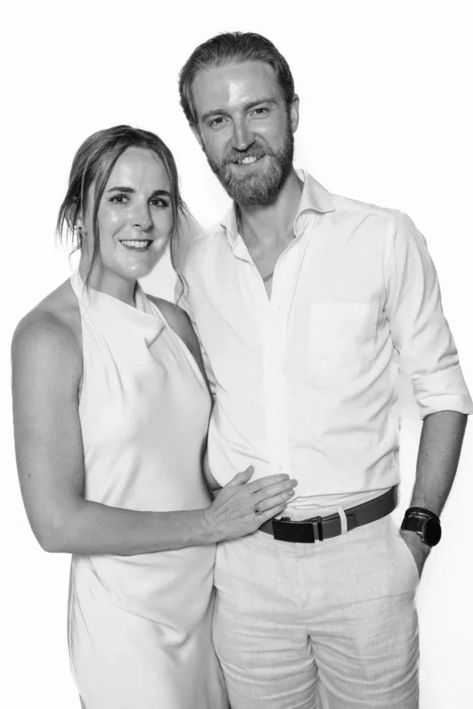Group of colleagues smiling in a black and white editorial portrait during a corporate brand activation in Lisbon.