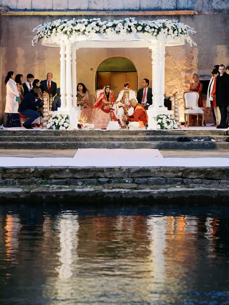 Hindu wedding at Penha Longa Resort in Cascais by a lake at the end of the day.