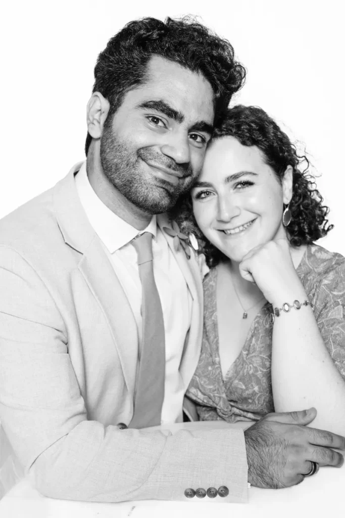 Wedding guests posing elegantly at the Portrait Station, our live photographic studio for events in Lisbon.