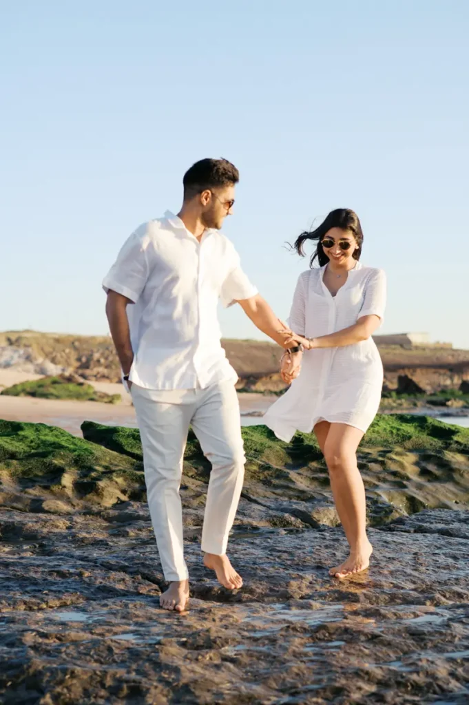 Couple Karishma and Shivam in their pre-wedding photo session at Guincho beach in Cascais in the late afternoon.