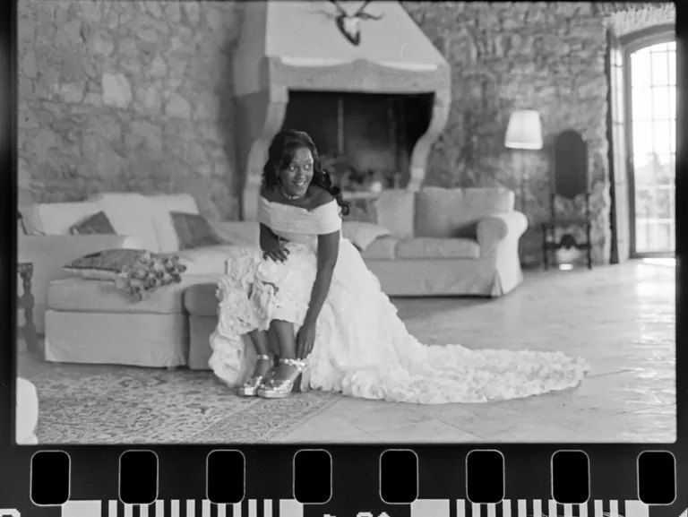 Bride preparing at her wedding day. Example of black and white film photography